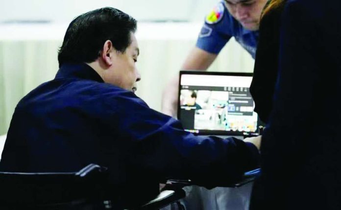 Nation_Romualdez_copy_compressed_resized Former House speaker Martin Romualdez is seen inside a room in the Bureau of Jail Management and Penology on Wednesday morning as he waits to attend his arraignment for plunder charges via teleconference.