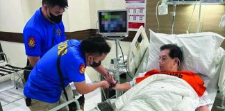 Personnel of the Criminal Investigation and Detection Group takes fingerprint samples from former House Speaker Martin Romualdez at the Cardinal Santos Medical Center in San Juan City, where he was arrested on September 7.