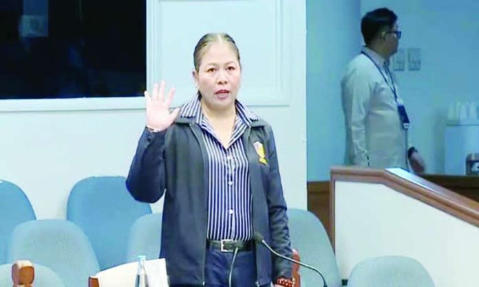 Nation_Sara_networth_copy_compressed_resized Lawyer Karen Batu, Officer-in-Charge of the Records Division of the Office of the Ombudsman, takes her oath as witness in the impeachment trial of Vice President Sara Duterte-Carpio.