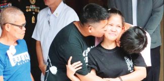 Mary Jane Veloso (second from right) is reunited with her two sons and her father (left) after she arrived at the Correctional Institution for Women in Manila on December 18, 2024 from Indonesia where she had been convicted for drug trafficking. The Indonesian government agreed to her repatriation despite her death sentence. AFP