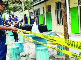Police secure the campus of Banga National High School in South Cotabato following a shooting allegedly involving a Grade 9 student who managed to sneak in a gun belonging to his father. PHILIPPINE DAILY INQUIRER, AMIEL CAGAYAN