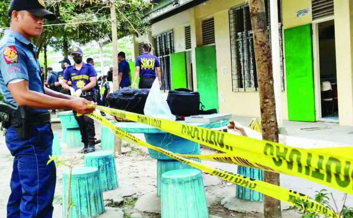 Police secure the campus of Banga National High School in South Cotabato following a shooting allegedly involving a Grade 9 student who managed to sneak in a gun belonging to his father. PHILIPPINE DAILY INQUIRER, AMIEL CAGAYAN