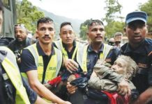 Nepal warns of new flood risk as hard-hit border region turns to ‘swampland’ Police officers carry a survivor from the flash floods in Nepa’'s Nuwakot district. Preliminary investigations have pointed to a collapsed glacier as the cause of the flash flood on the Nepal-Tibet border, highlighting the issue of rapidly melting Himalayan ice, scientists say. REUTERS