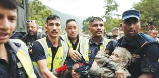Police officers carry a survivor from the flash floods in Nepa’'s Nuwakot district. Preliminary investigations have pointed to a collapsed glacier as the cause of the flash flood on the Nepal-Tibet border, highlighting the issue of rapidly melting Himalayan ice, scientists say. REUTERS