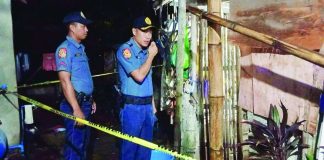 Police investigators examined the residence in Barangay Cabanbanan, Oton, Iloilo where an 11-year-old girl was found dead on Wednesday night, September 16. Two kitchen knives were reportedly recovered from the second floor as part of the investigation. RADYO MERKADO ILOILO PHOTO