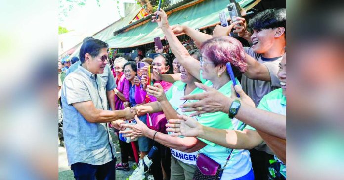 President Ferdinand R. Marcos Jr. greets well-wishers in in Sta. Barbara, Pangasinan where he spearheaded the delivery of integrated health and nutrition services during a visit to Sta. Barbara Central School on September 17. PCO