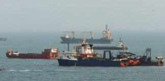 Commercial ships are anchored in the Strait of Hormuz, off the coast of Bandar Abbas, Iran. The strait has effectively been closed since the start of the war in Iran. GETTY IMAGES
