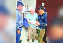 PRO-NIR personnel arrested the 78-year-old suspect (center) at the Cottage Road Hall of Justice in Barangay 9, Bacolod City, on September 10, 2026, on a warrant for four counts of libel. PRO-NIR PHOTO
