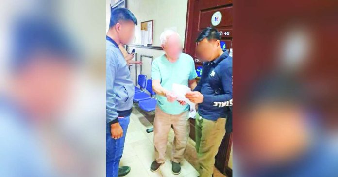 PRO-NIR personnel arrested the 78-year-old suspect (center) at the Cottage Road Hall of Justice in Barangay 9, Bacolod City, on September 10, 2026, on a warrant for four counts of libel. PRO-NIR PHOTO