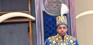 King Oyo pictured at 18 during his coronation wearing a gold embroidered jacket and hat. King Oyo ascended to the throne at the age of three but was crowned on reaching adulthood at 18 in 2010. AFP VIA GETTY IMAGES