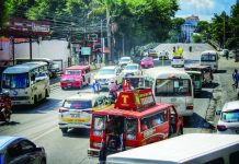 FARE HIKE SQUEEZES HOUSEHOLD BUDGETS; Transport costs eat into food, school spending Commuters and public utility vehicles navigate a busy street in La Paz, Iloilo City on Monday morning, Sept. 28, as the newly approved public transport fare increases officially took effect. Low-income workers and parents feared rising transportation costs will consume funds needed for essential household expenses, including food and schooling. ALLEN ANIMAS/PN