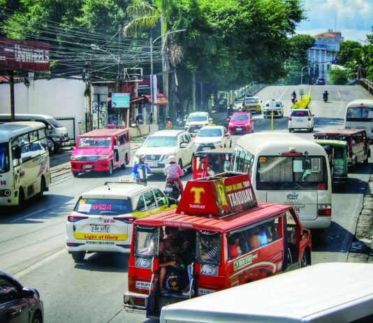 FARE HIKE SQUEEZES HOUSEHOLD BUDGETS; Transport costs eat into food, school spending Commuters and public utility vehicles navigate a busy street in La Paz, Iloilo City on Monday morning, Sept. 28, as the newly approved public transport fare increases officially took effect. Low-income workers and parents feared rising transportation costs will consume funds needed for essential household expenses, including food and schooling. ALLEN ANIMAS/PN