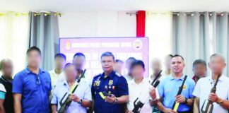 Guimaras Police Provincial Office (GPPO) director Colonel Ferdinand N. Navales (center) leads police officials and local chief executives during the ceremonial turnover of 101 surrendered loose firearms. Guimaras achieved a 100 percent participation rate in Project RTT 3389 after all 98 barangays across its five municipalities voluntarily surrendered at least one unregistered firearm to authorities. PRO-6 PHOTO