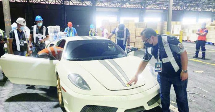 higher_tax_compressed_resized Customs officers inspect a luxury car at Manila International Container Port. Under the proposed Progress Bill, the Department of Finance is looking to raise the tax rate on luxury and nonessential goods to 25 percent from 20 percent. FILE PHOTO COURTESY OF BOC