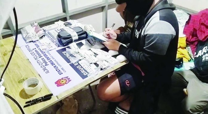 Authorities conduct an on-site inventory of the 710 grams of suspected shabu valued at P4,828,000, along with paraphernalia and buy-bust money, seized during an early morning raid in Barangay San Isidro, La Paz, Iloilo City on Monday, August 31, 2026. ICPO PHOTO