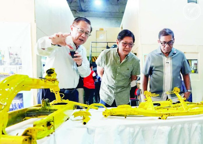 local_manufacturing_compressed_resized Pres. Ferdinand “Bongbong” Marcos Jr. (center) visits a steel processing center in Biñan City, Laguna on September 26 to inspect the Department of Science and Technology’s assistance to the company in adopting Industry 4.0 technologies through the Small Enterprise Technology Upgrading Program. PRESIDENTIAL COMMUNCATIONS OFFICE PHOTO