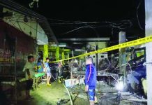 Firefighters cordoned off the charred remains of the frozen goods section at the Patnongon Public Market in Barangay Poblacion, Patnongon, Antique after a late-night fire damaged two stalls and left P600,000 in estimated damages on Tuesday, Sept. 15, 2026. ELVIC F. BALLENAS PHOTO
