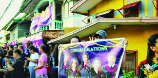 Law students and supporters gather outside Central Philippine University in Jaro, Iloilo City, displaying banners and cheering on aspiring lawyers taking the 2026 Bar Examinations. CPU is the lone Bar testing center for Western Visayas and the Negros Island Region, drawing examinees from law schools across the two regions. ALLEN ANIMAS/PN