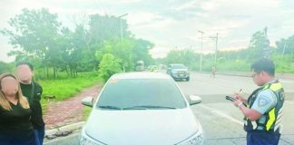 An enforcement officer of the Land Transportation Office - Region 6 inspects a sedan intercepted along the Circumferential Road in Barangay Buhang, Jaro, Iloilo City for allegedly transporting paying passengers without the required franchise. LTO has apprehended 188 “colorum” vehicles across Western Visayas since January as it intensifies its campaign against unauthorized passenger transport. LTO-6
