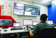 A MORE Electric and Power Corporation (MORE Power) employee monitors power generation and grid conditions at MORE Power’s control room in Iloilo City. The distribution utility says insufficient available supply is affecting all distribution utilities connected to the grid, including its operations in the city.