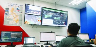 A MORE Electric and Power Corporation (MORE Power) employee monitors power generation and grid conditions at MORE Power’s control room in Iloilo City. The distribution utility says insufficient available supply is affecting all distribution utilities connected to the grid, including its operations in the city.