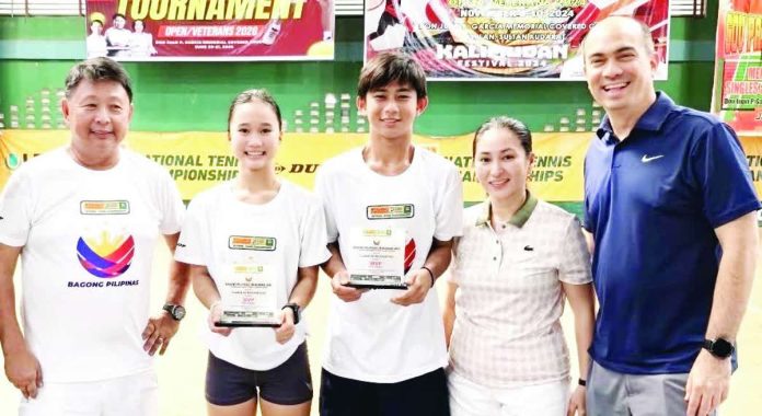 sports_Bugna_compressed_resized Triple-crown winner Kathlyn Bugna (second from left) beams as she poses with (from left) coach Ronald Martin, fellow MVP Krelz Gecosala, and Lia and Erwin Garcia of A.C. Garcia Group of Companies. CONTRIBUTED PHOTO