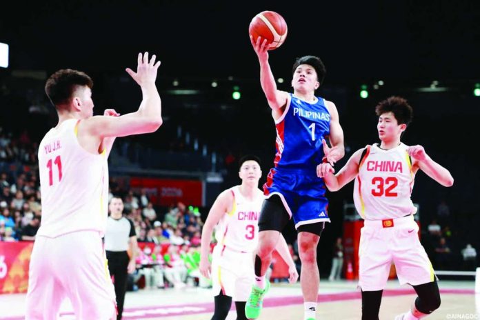 sports_Gilas_compressed_resized Gilas Pilipinas guard Adrian Nocum drives for a basket against the China defense during their Asian Games encounter. ASIAN GAMES