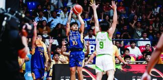 Jose Rizal University Heavy Bombers’ Laurence Mangubat pulls up for a three-pointer against College of Saint Benilde. NCAA