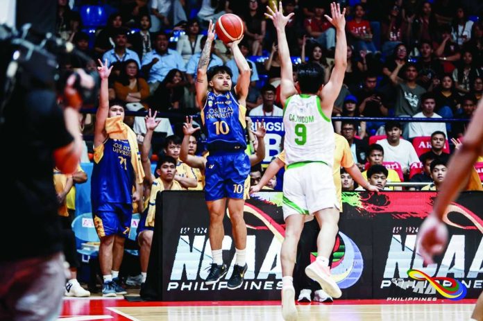 Jose Rizal University Heavy Bombers’ Laurence Mangubat pulls up for a three-pointer against College of Saint Benilde. NCAA
