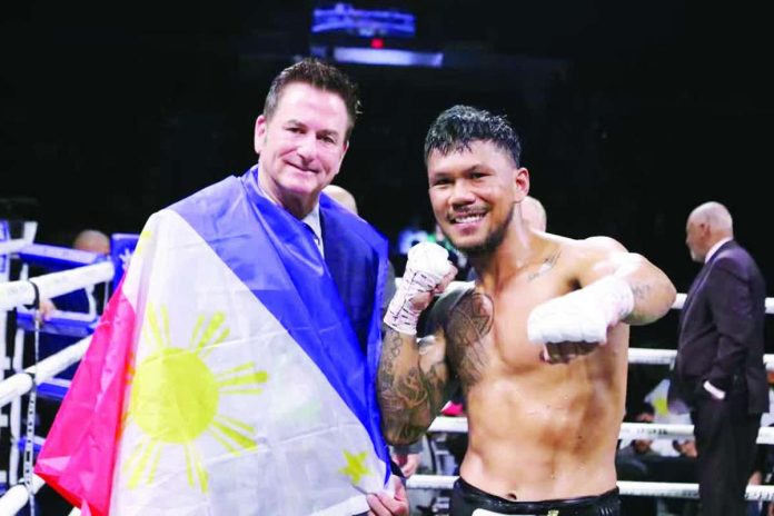 sports_Marcial_compressed_resized Filipino boxer Eumir Marcial poses with promoter Sean Gibbons following his third-round knockout victory over Mexico’s Omar Ulises Huerta at Pechanga Arena in San Diego, California. PHOTO COURTESY OF JHAY OH OTAMIAS