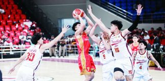 University of Perpetual Help Altas big man Juan Tulabut blocks the shot attempt of San Sebastian College-Recoletos Golden Stags’ Ralph Gabat during their NCAA Season 102 men’s basketball encounter. Tulabut led the Altas with 18 points in their 86-74 victory. NCAA PHOTO
