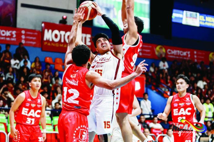 University of Perpetual Help Altas’ Juan Tulabut attacks the defense of Emilio Aguinaldo College Generals’ Jason Shanoda and Wilmar Oftana during their NCAA Season 102 men’s basketball game. NCAA
