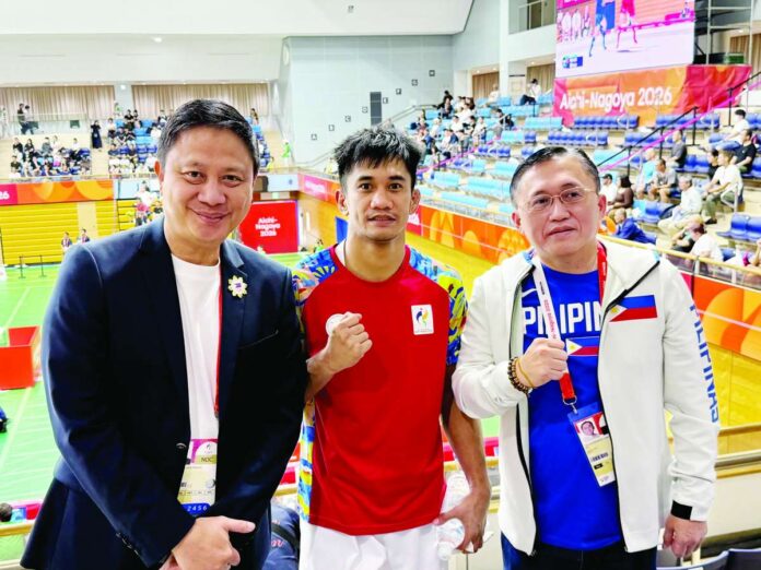 sports_Saclag_compressed_resized Mixed martial arts fighter Jean Claude Saclag poses with Philippine Sports Commission chairman Patrick Gregorio and Sen. Christopher “Bong” Go after advancing to the men’s traditional -65kg final of the 2026 Asian Games in Nagoya, Japan. Saclag is one victory away from delivering the Philippines its first gold medal of the Games. POC