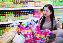 DOH backs tax hike on sweet drinks A shopper checks out essential household items and grocery staples at SM Supermarket. The Department of Finance had suggested increasing the tax on sugary drinks with caloric or noncaloric sweeteners to P20 per liter and charge P40 per liter for beverages containing high-fructose syrups. SM MARKETS/FACEBOOK PHOTO