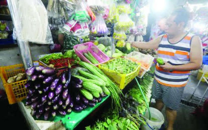 temporary_adjustments_compressed_resized Fresh vegetables are displayed at a stall in a public market in Manila on Sept. 1, 2026. The Department of Agriculture said on Friday, Sept. 4, 2026, it is actively tracking retail prices of vegetables and fish following the recent typhoons and habagat rains. PNA PHOTO BY YANCY LIM