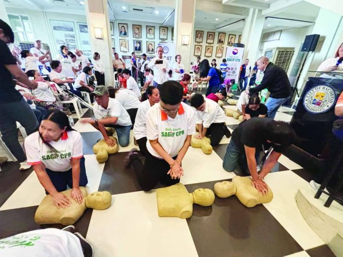 Participants perform Hands-Only CPR during a life-saving training program at the Bacolod City Government Center lobby on October 22, 2026. MAE SINGUAY/PN
