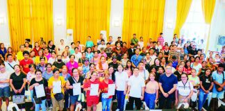Flower and candle vendors receive their special permits and identification cards from the Bacolod City government on October 29 ahead of the Undas 2026 observance. The permits authorize them to operate in designated vending areas until November 2. BCCO-PIO PHOTO