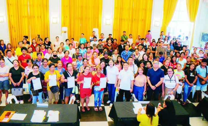 Bacolod_permit_compressed_resized Flower and candle vendors receive their special permits and identification cards from the Bacolod City government on October 29 ahead of the Undas 2026 observance. The permits authorize them to operate in designated vending areas until November 2. BCCO-PIO PHOTO