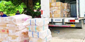 Suspected illicit cigarettes valued at P4.35 million were confiscated during a joint law enforcement operation in Barangay Balicotoc, Ilog, Negros Occidental, on October 18, 2026. Police arrested two men in connection with the shipment. PRO-NIR PHOTO