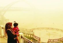 Who’s to blame for the toxic smog choking South East Asia? A mother and her child wearing facemasks look on from a bridge as thick haze from forest and land fires block their view of a region in Palangkaraya, Central Kalimantan, Indonesia. Persistent haze this year has prompted Indonesian authorities to step up efforts to punish offenders. GETTY IMAGES