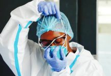 10 people linked to Kenya’s first Ebola case quarantined A nurse wears in white protective clothes and blue gloves at an Ebola isolation facility in Kenya. REUTERS