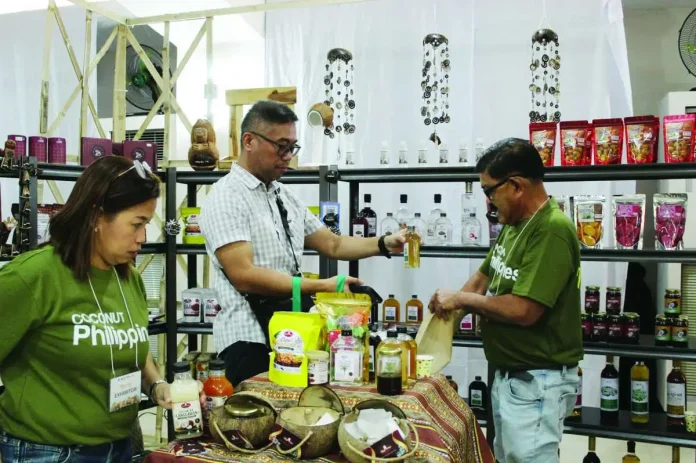 Locals and tourists explore coconut-based food and non-food products from Aklan, Antique, Capiz, Guimaras, and Iloilo at the Negolinks booths at the La Carmela de Boracay Hotel in Malay, Aklan. DTI REGION VI PHOTO