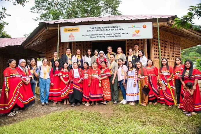 MWEW Bukidnon Photo 1 A new milestone for Maybank Women Eco Weavers in the Philippines. The official launch of the MWEW ANTHILL Abaca Weaving Training Centre in Bukidnon brought together the Daraghuyan Bukidnon Tribe, Maybank Foundation, ANTHILL Fabric Gallery and local partners to celebrate a shared commitment to preserving cultural heritage and strengthening community livelihoods. The launch of the MWEW ANTHILL Abaca Weaving Training Centre in Bukidnon marks the programme’s 13th training centre across five ASEAN countries and its second in the Philippines. To date, MWEW has supported 20 women weavers and 25 abaca farmers in the Daraghuyan community, alongside the planting of 6,250 abaca plants. By bringing fibre cultivation and weaving closer together, the centre strengthens the local value chain while creating a foundation for sustainable livelihoods and the preservation of Pinangabol weaving. Standing in the back row from left; Emma Lim-Sandrino, Board of Directors, ANTHILL Fabric Gallery (with glasses and in black shirt), Marven Jan Nadela, Senior Tourism Operations Officer, Malaybalay City Tourism Office (with glasses in black jacket); Atty. Anna Marie R. Bergado, City Administrator, Malaybalay City (in light pink jacket); Anya Joy Lim, Princess Ant/Co-Founder of ANTHILL Fabrics Gallery (in beige t-shirt); Noor Fadzlin Ariffin, Head, Community Empowerment, Maybank Foundation (in army green shirt); Bae Inatlawan Adelina Tarino, Tribal Leader, Daraghuyan Bukidnon Tribe (in tribal costume and white headscarf); Johann Nawawi, Architect Benefactor of MWEW Programme (with glasses in army green shirt); Edelyn Castro, Head, Corporate Affairs, Maybank Philippines (in army green shirt); Cecille Egnar, Provincial Environment and Natural Resource Officer, Bukidnon Environment & Natural Resources Office (in black jacket); Artificio Lacang, Jr., Visayas-Mindanao Region Head, Maybank Philippines (in army green shirt) and Rochelle Astreid Raymundo, Community Development Programme Consultant, ANTHILL Fabric Gallery (in white jacket). Standing in the front row with the weavers, third from the left: Maria Easterluna Canoy, Executive Director, Kintanglad Integrated NGOs (in purple shirt and black lace vest); Annie Lim, Queen Ant/Co-Founder, ANTHILL Fabric Gallery (in white shirt); Salome Tarino, Community Manager of Daraghuyan Bukidnon Balay Hu Paglala Ha Abaca (tenth from left in red tribal dress); Amirul Muhammad, Senior Manager, Community Empowerment, Maybank Foundation (in army green shirt and dark green pants); and Jonnalyn Mangga, Trainer/Weaver, Daraghuyan Bukidnon Tribe (in light pink shirt and denim pants).