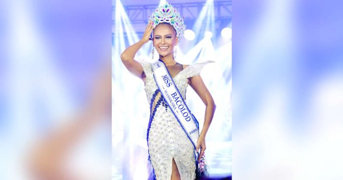 Miss Bacolod copy_superimposed Newly crowned Miss Bacolod MassKara 2026 Macy Alaine E. Albarico, representing Barangay Singcang-Airport, celebrates her victory after besting 14 other candidates during the pageant night at STI West Negros University in Bacolod City on October 11. Albarico also won the Miss Congeniality award. CESAR JOLITO III PHOTO