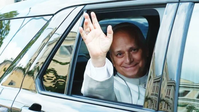 Pope Leo XIV waves from the window of a car as he leaves Rome’s Gemelli University Hospital. The Pope was diagnosed with lung cancer after the surgery at the hospital Tuesday last week, which the Vatican said had been "successful" and proceeded without complications. REUTERS