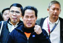 Apollo Quiboloy (center), pastor and founder of the Philippine-based Kingdom of Jesus Christ church, arrives to attend a hearing at the Senate in Manila in this photo taken on Oct. 23, 2024, over accusations of human trafficking and sexual abuse of a minor. The United States has formally requested the extradition of Quiboloy who is wanted there on sex-trafficking charges. FILE PHOTO FROM AGENCE FRANCE-PRESSE
