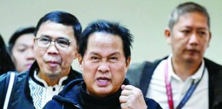 Apollo Quiboloy (center), pastor and founder of the Philippine-based Kingdom of Jesus Christ church, arrives to attend a hearing at the Senate in Manila in this photo taken on Oct. 23, 2024, over accusations of human trafficking and sexual abuse of a minor. The United States has formally requested the extradition of Quiboloy who is wanted there on sex-trafficking charges. FILE PHOTO FROM AGENCE FRANCE-PRESSE