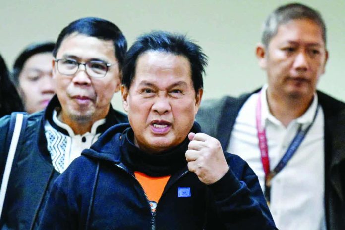 Quiboloy_copy_compressed_resized Apollo Quiboloy (center), pastor and founder of the Philippine-based Kingdom of Jesus Christ church, arrives to attend a hearing at the Senate in Manila in this photo taken on Oct. 23, 2024, over accusations of human trafficking and sexual abuse of a minor. The United States has formally requested the extradition of Quiboloy who is wanted there on sex-trafficking charges. FILE PHOTO FROM AGENCE FRANCE-PRESSE