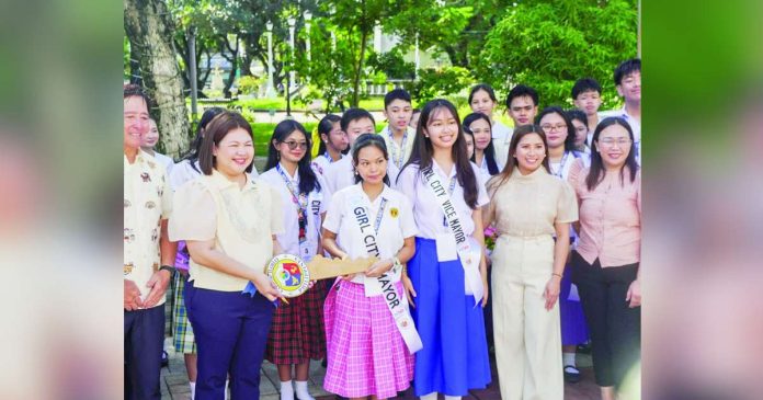 Iloilo City’s Mayor Raisa Treñas turns over the symbolic Key of Iloilo City to Girl City Mayor Alexa Jaci L. Bataan of the University of the Philippines Visayas - Iloilo during the opening ceremony of the Boys’ and Girls’ Week Celebration 2026 at Plaza Libertad on Monday, October 19. The annual initiative, held in partnership with the Rotary Club of Iloilo City, gives student leaders first-hand experience in local governance and public service for one week. ILOILO CITY PIO