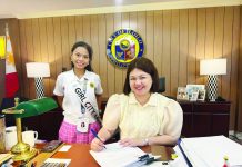 TOWARD A MORE HOLISTIC HOUSING SOLUTION. Iloilo City’s Mayor Raisa S. Treñas signs the PASILONG Code, with Girl Mayor Alexa Jaci L. Bataan of the University of the Philippines High School-Iloilo. The code institutionalizes the city’s housing program, which goes beyond providing homes to building safer, more sustainable communities with better opportunities for Ilonggo families.